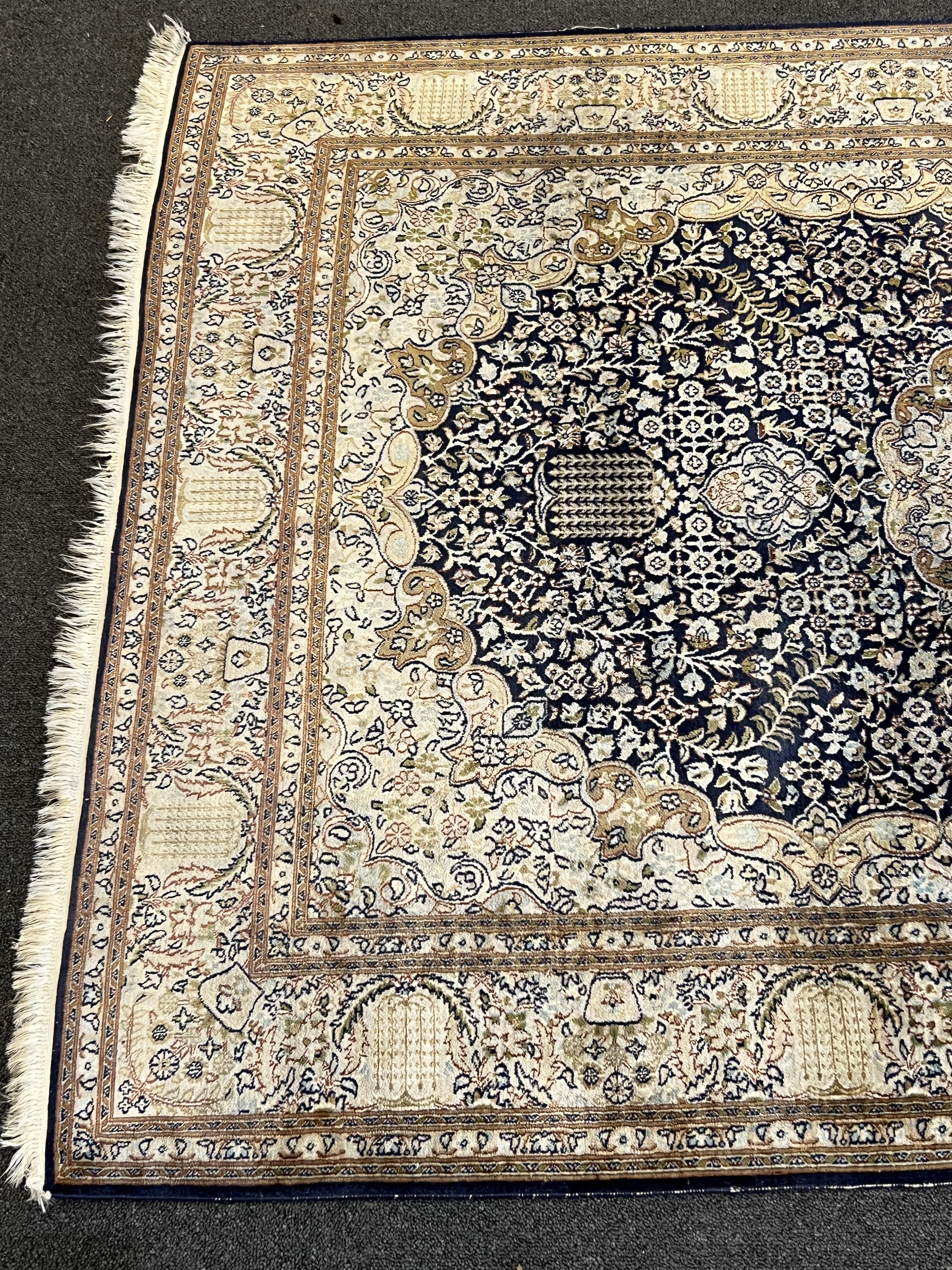 A Persian silk rug, 180 x 120cm